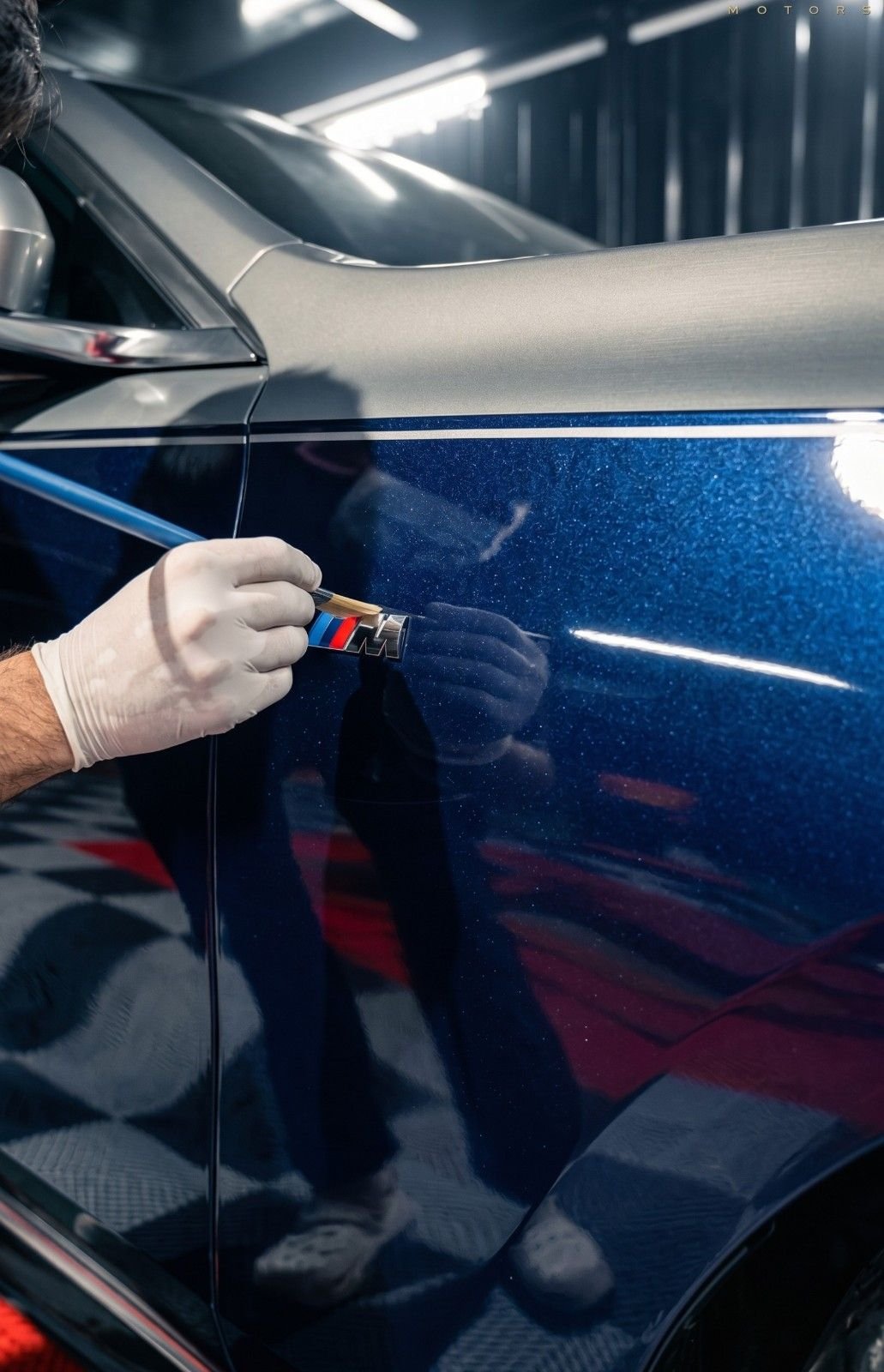 Paint protection film being applied on car door